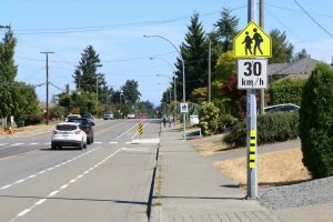 School Zone sign (Advisory) with regulatory sign attached for posted 30 km/h speed limit (photo by WestCoastDriverTraining.com)