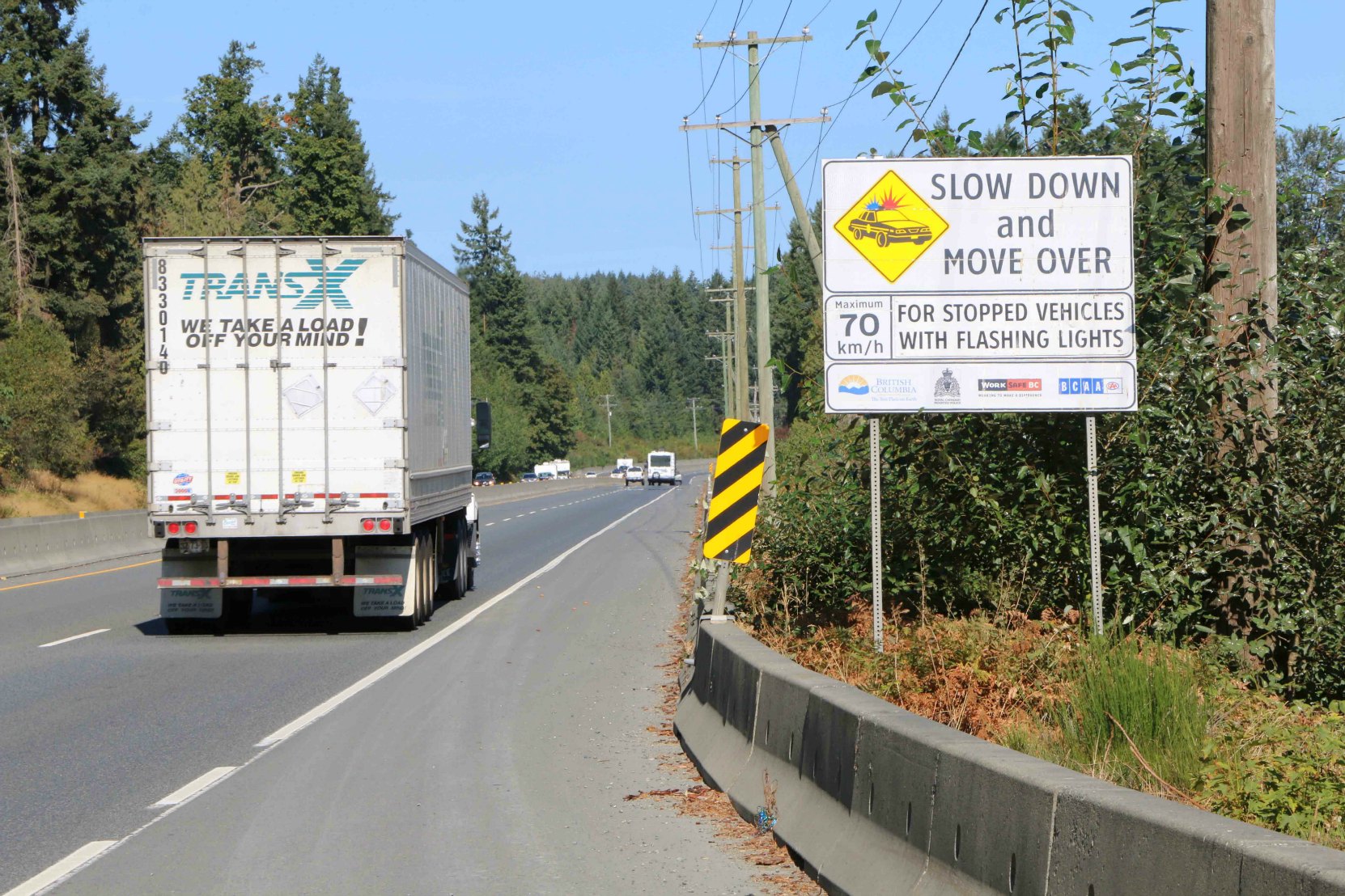 Sign on the Trans-Canada Highway on Vancouver Island stating the British Columbia laws for driving around emergency vehicles on B.C. highways. (photo by West Coast Driver Training & Education)