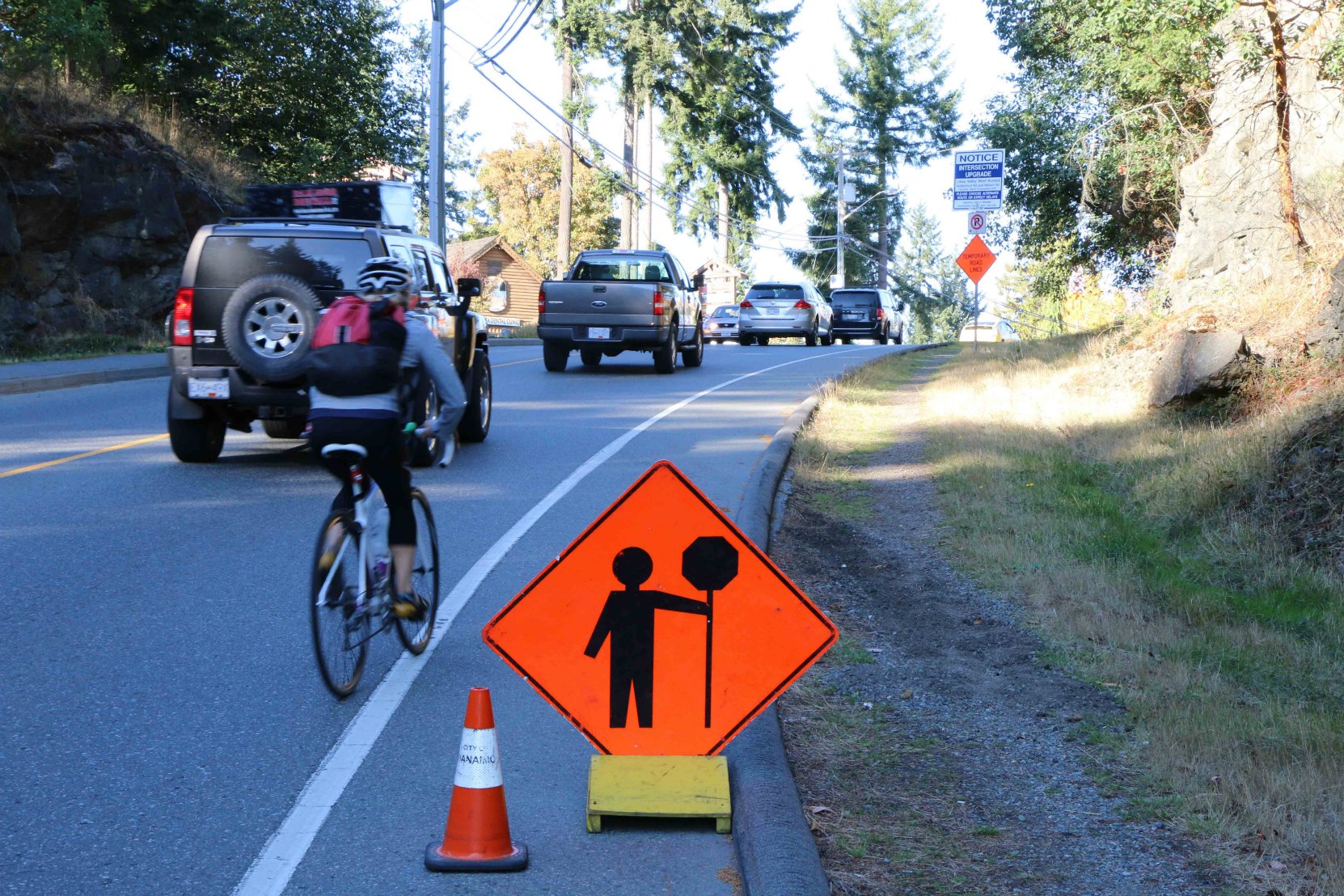 Temporary highway construction zone sign indicating a flagger ahead. The Motor Vehcicle Act requires drivers to follow the directions of flaggers in highway construction zones.(photo by WestCoastDriverTraining.com)