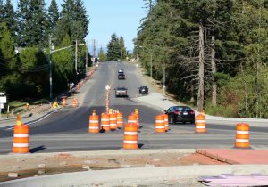 A typical roadway construction zone in British Columbia marked with Orange and Black signs, pylons and markers (photo by WestCoastDriverTraining.com)