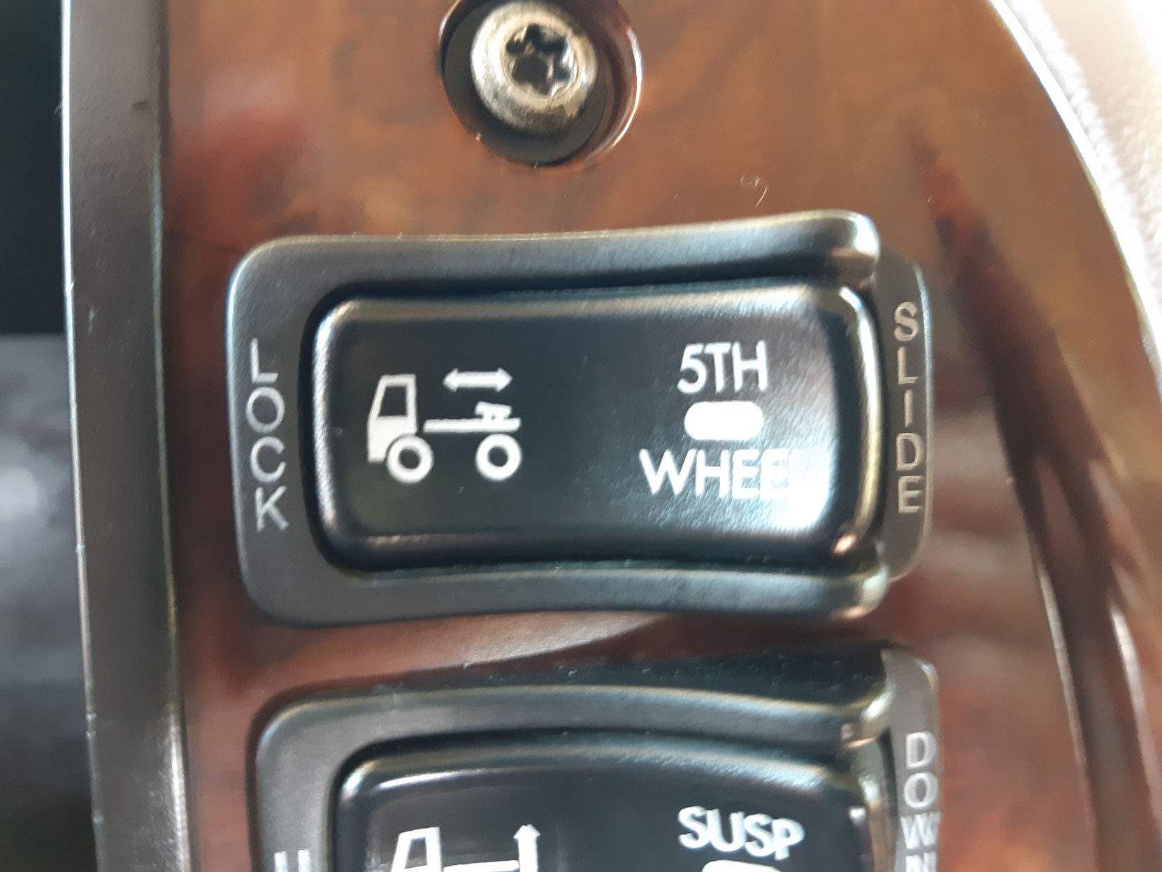 5th Wheel Slide switch on the dash of our Mack Vision day cab (photo: West Coast Driver Training & Education Inc.)