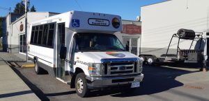 Our Ford E450 20 seat bus at Mark's Instant Sign Shop awaiting application of its final signage [Photo: West Coast Driver Training]