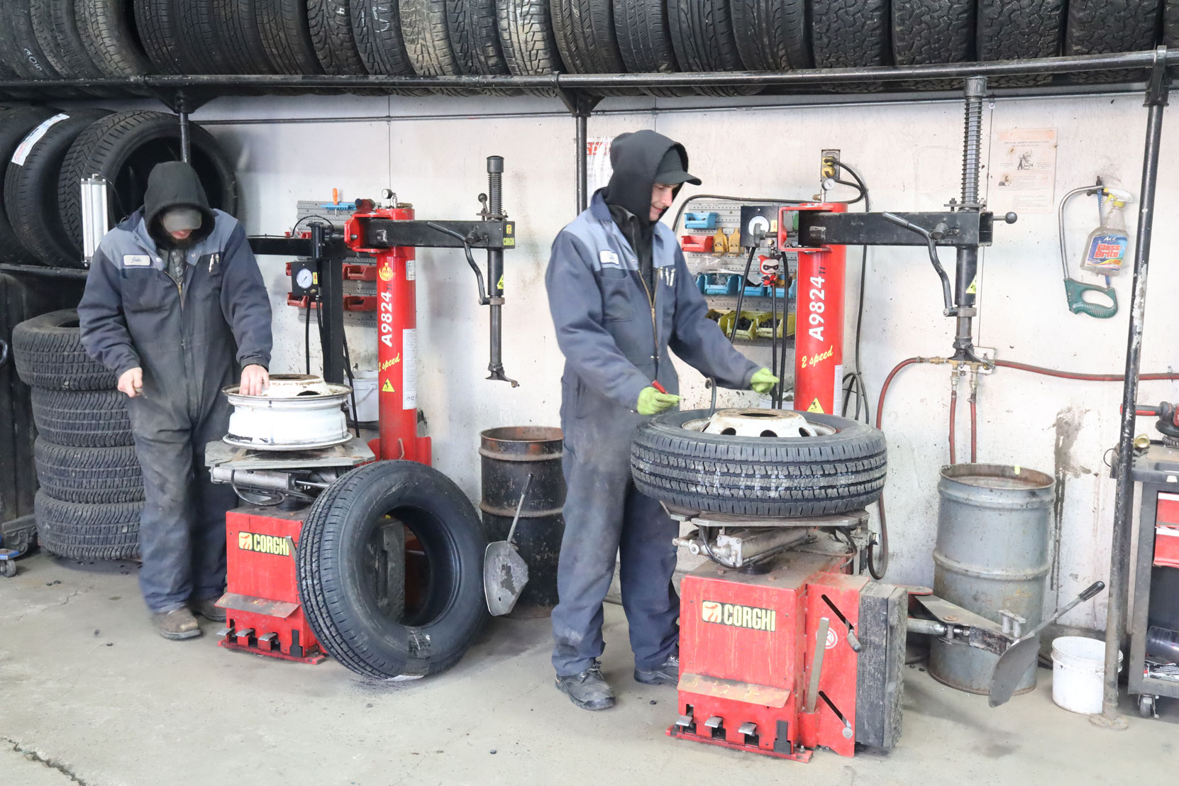 New B.F. Goodrich tires being put on the wheels before being installed on the steering axle of our Ford E450 bus at Joe's Tire Hospital, February 2023 [photo: West Coast Driver Training]