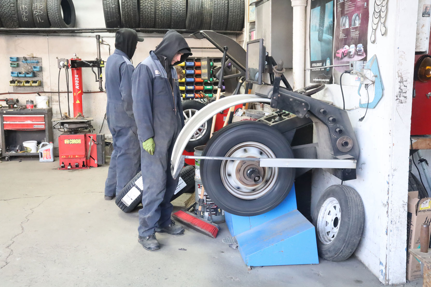 Wheel balancing before the new steering axle tires installed on our Ford E450 bus at Joe's Tire Hospital, February 2023 [photo: West Coast Driver Training]