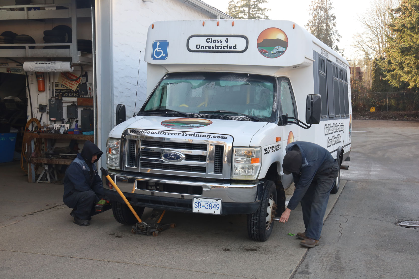 Our Ford E450 bus after getting new steering axle tires installed at Joe's Tire Hospital, February 2023 [photo: West Coast Driver Training]