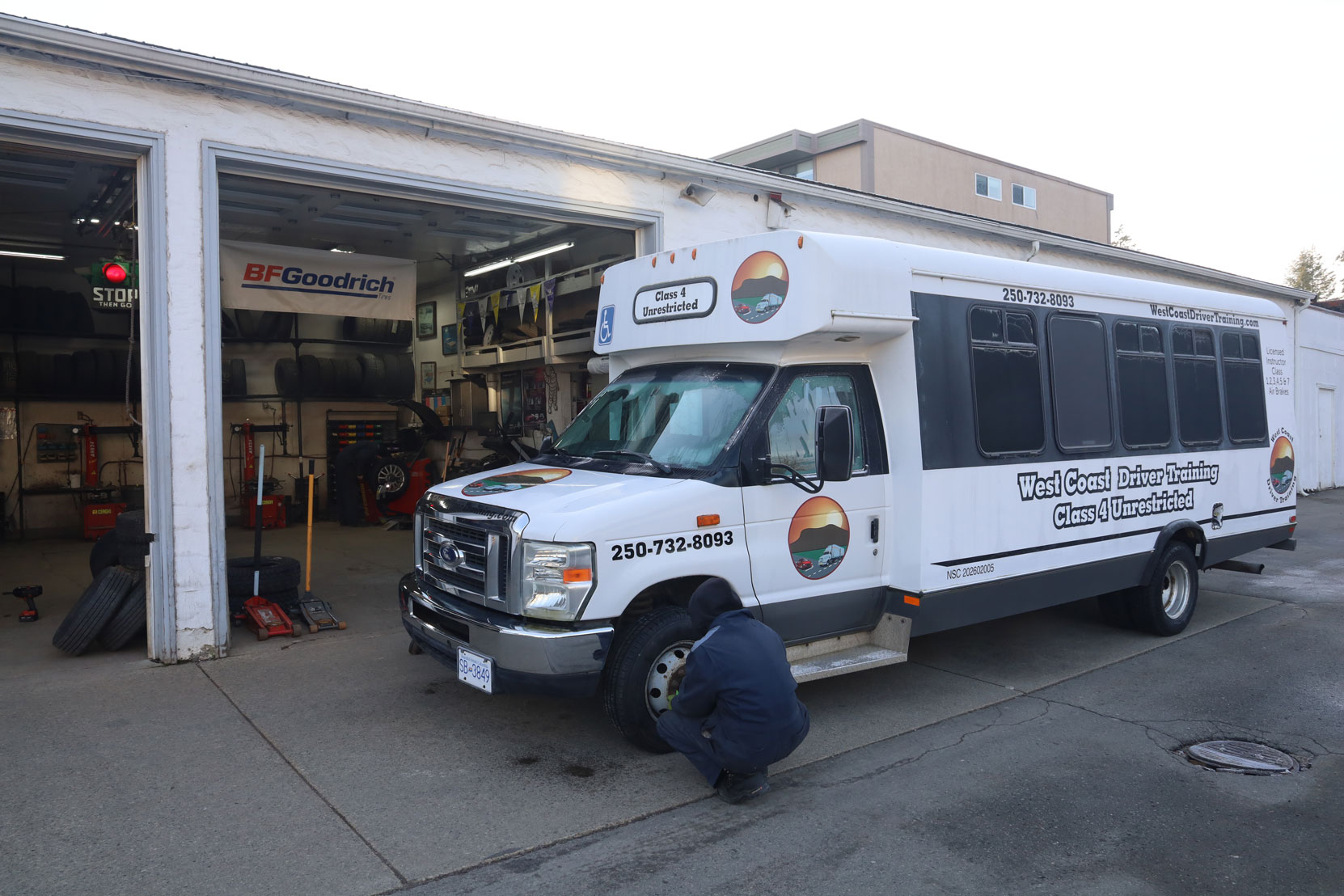 Our Ford E450 bus after getting new steering axle tires installed at Joe's Tire Hospital, February 2023 [photo: West Coast Driver Training]